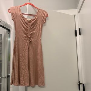 Blush skater dress with cinched top.